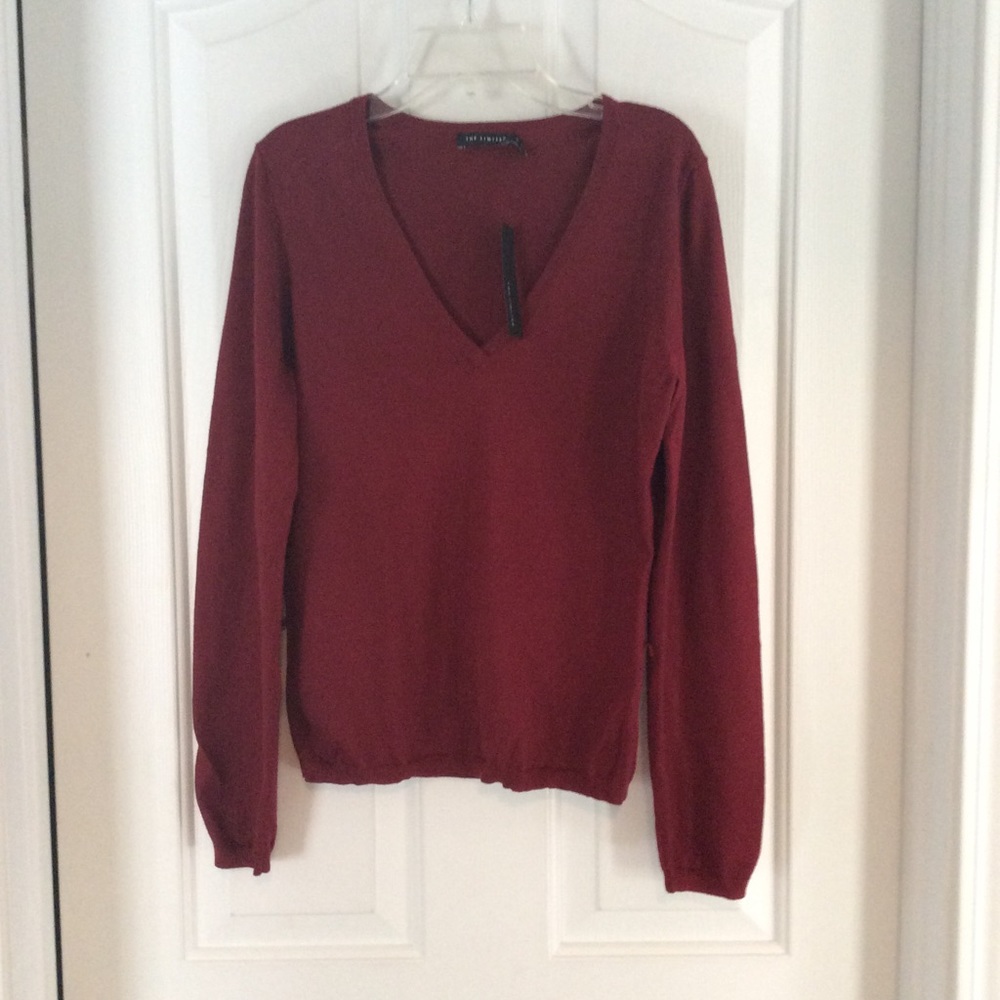 Classic burgundy v-neck sweater.